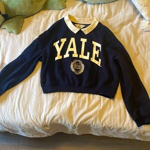 Dark blue and white Yale cropped long sleeve shirt.